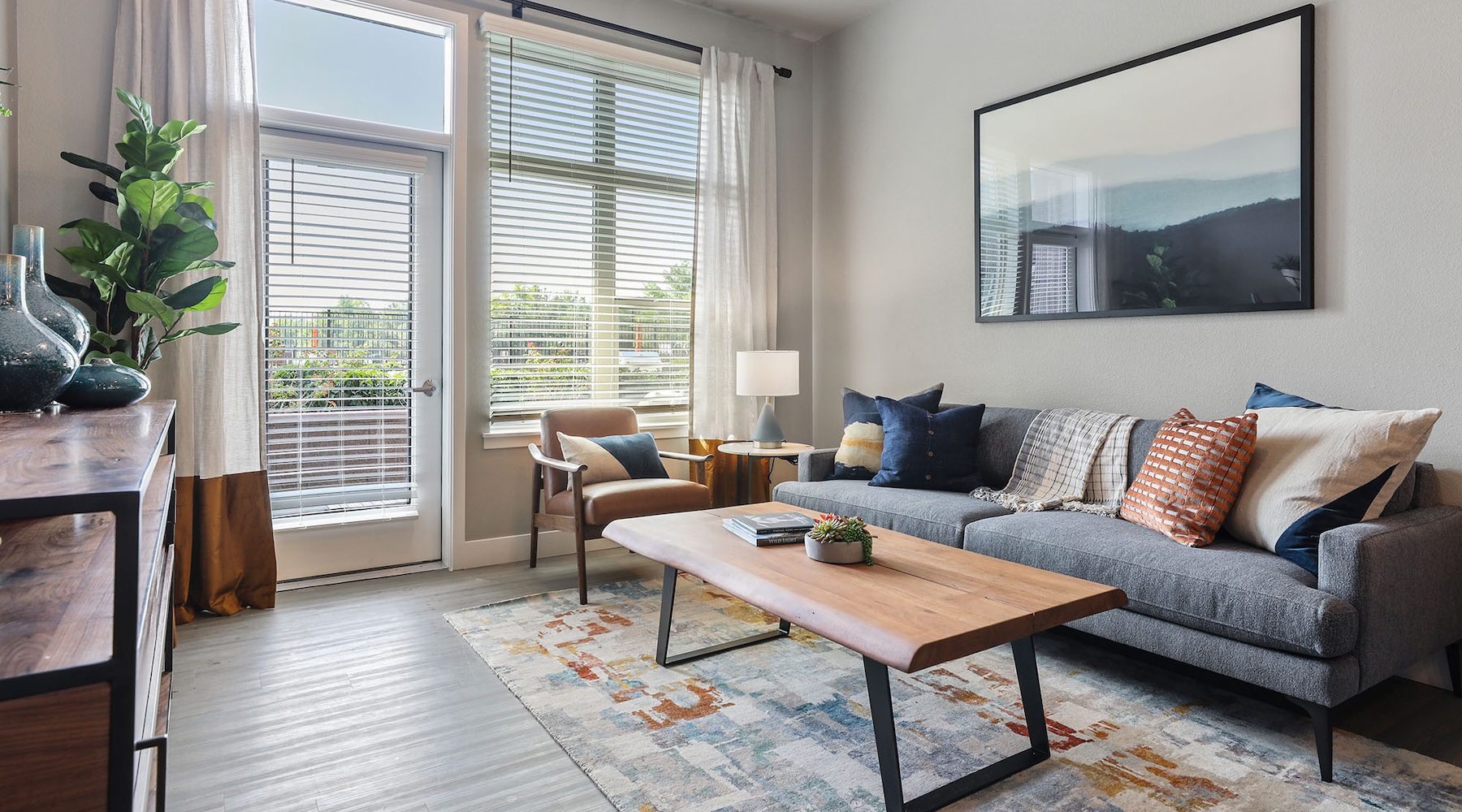 a living room with a couch, chair and coffee table