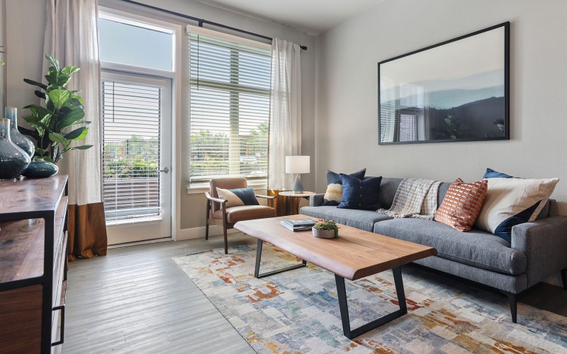 a living room with a couch, chair and coffee table