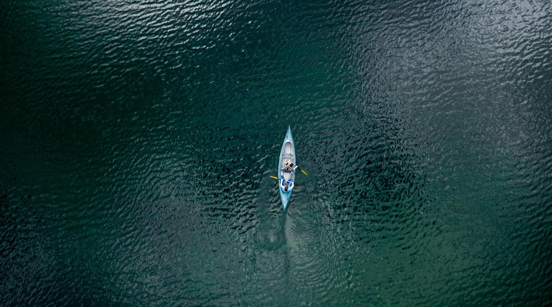 two people canoeing