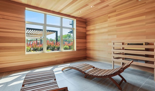a sauna with wooden chairs