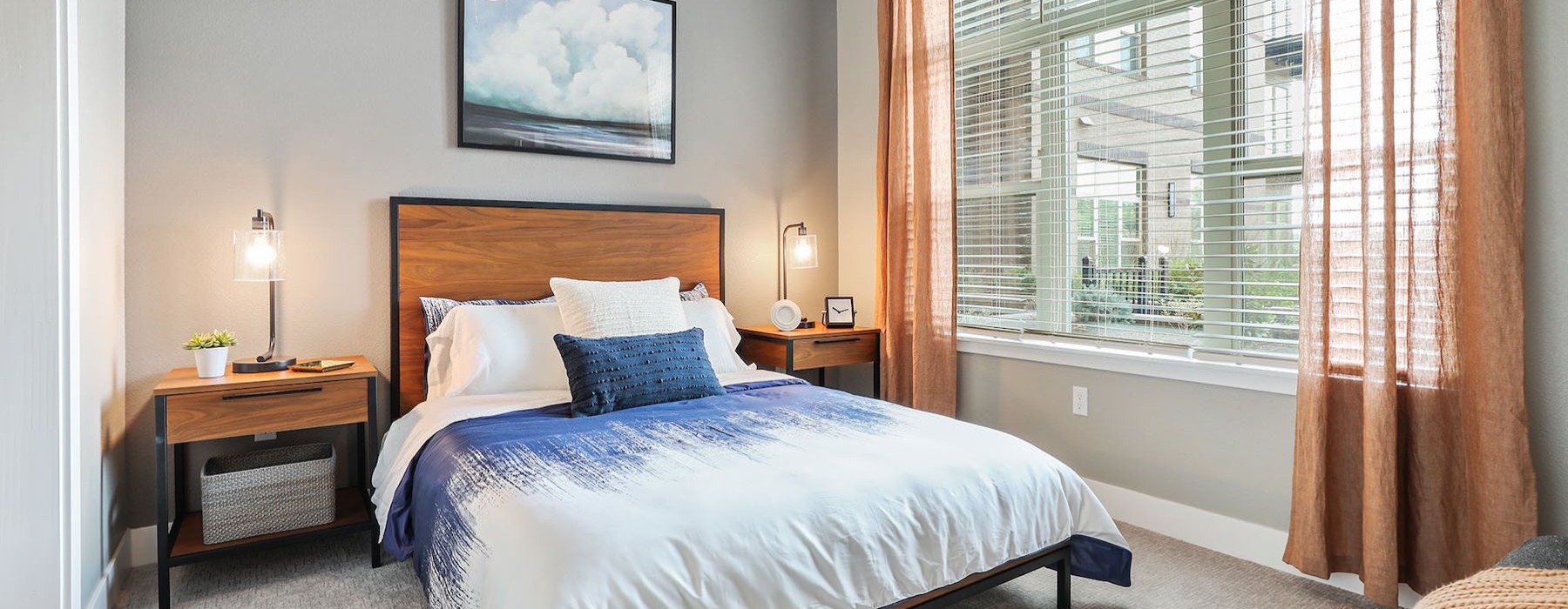 a bedroom with a bed and two nightstands