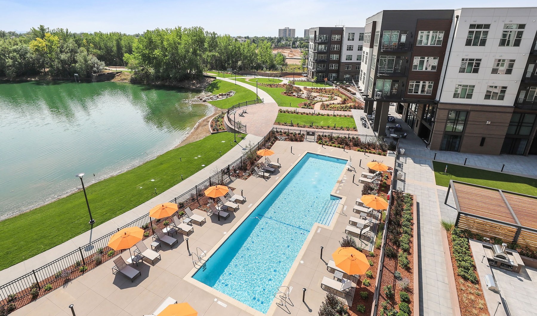 an aerial view of an apartment complex with a pool